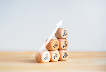 Poster - Save money icon on wooden blocks bar graph chart steps with rising arrow on wood table and white background. Business growing process, market growth, profit, investment, economic improvement concepts.