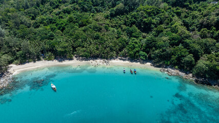 Wall Mural - Aerial view banana beach white tropical beach with long-tail boat  and palm tree in banana beach, Tropical beach with clear water at Banana beach, Phuket, Thailand.