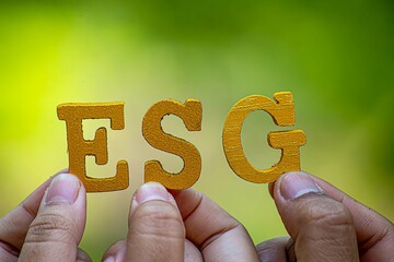 Wall Mural - ESG concept of environmental, social, and governance. Sustainable corporation development. words ESG on a wood block on the environmental background.Idea for sustainable organizational