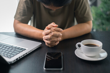 Wall Mural - Christian online religion technology concept. Hands praying of christian with digital computer laptop, Online live church for sunday service. Asian woman praying in darkness with computer laptop.