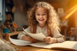 little girl working on paper in school