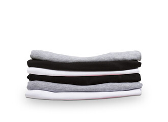 Poster - A stack of folded t-shirts in gray, black, and white on a pure isolated background, depicting the concept of apparel organization