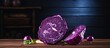 Two halves of purple cabbage displayed on a rustic wooden table next to a sharp knife