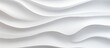 A detailed close-up of a textured white wall with a unique wave pattern design, creating a visually appealing background