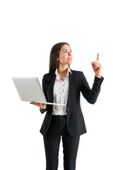 Wall Mural - Professional woman holding a laptop and pointing upwards, photographed against a white background, illustrating a business concept