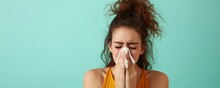 Woman Blowing Her Nose With A Tissue, She Appears Sick; Suitable For Healthcare Or Seasonal Allergy Awareness.