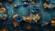 The image is of a rusted metal surface with a lot of holes and bumps. The surface is a mix of blue and orange, giving it a somewhat eerie and unsettling appearance. The texture of the surface is rough