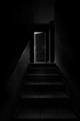 Black and white image of a dark staircase with a door ajar at the end, like a scene from a horror movie