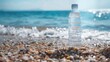 Bottled water on pebbly beach with waves - Crisp image of a clear water bottle on a pebbly beach with foamy waves and a beautiful seascape