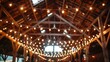A rustic barn wedding with string lights and wooden decor. 