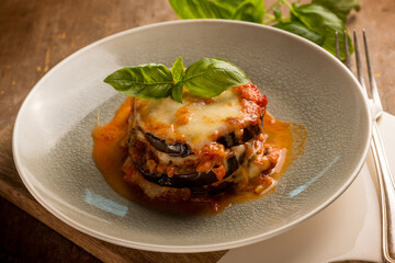 Poster - eggplants parmigiana with basil leaves