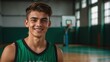 Young handsome male senior high athlete on green jersey uniform portrait image on basketball court gym background smiling looking at camera from Generative AI