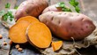 Close up of fresh Sweet Potatoes on a rustic wooden Table