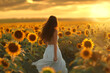 young woman in a white dress walking through a sunflowe a5142d9e-e99f-4645-9386-844220296fff