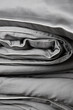 close-up of a gray satin bedding set