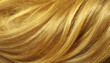 © happyjack29 - Closeup view of a bunch of shiny straight blond hair in a wavy curved style. Hair care concept