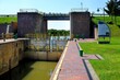 Lock gates of the water dam in river. Dam on river Nogat in Biala Gora (Biała Góra).