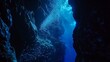 Undersea cave illuminated by bioluminescent organisms, revealing hidden details of the environment no dust