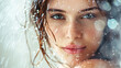 Beautiful female model in advertisement with water on her face.