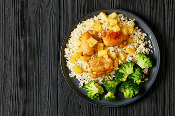 Canvas Print - chicken thighs with pineapple, rice and broccoli