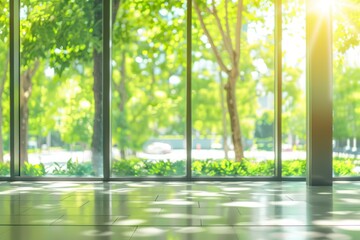 Wall Mural - Blurred empty modern open space office with large windows and green trees on the outside