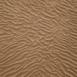 Top view of wavy sand dunes - fractal sea sand texture background