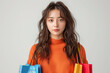 Stylish Shopper with Colorful Bags in Trendy Orange Sweater, Online Shopping Concept