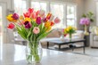 Colorful tulips in a vase on the table.