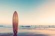 © olga_demina - Surfboard standing on the beach at sunset. Ready to ride the evening waves.