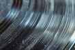 : A detailed shot of a vinyl record, with contrasting textures of smooth grooves and rough, scratched surfaces,