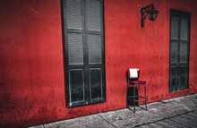 Black Door On A Red Wall