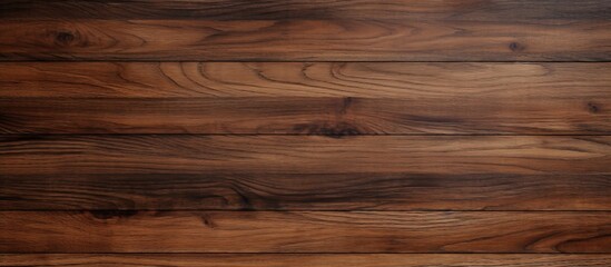Wall Mural - A closeup shot of a brown hardwood plank flooring with a blurred background, showcasing the natural wood grain pattern and beige tones