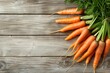 Carrots bunch of fresh organic vegetarian food on rustic wooden background. Rustic style and natural style