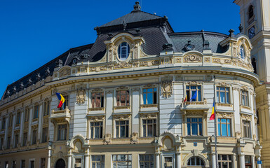 Canvas Print - City Hall building and Tower of Jesuit Church of Holy Trinity in Old Town of Sibiu, Romania