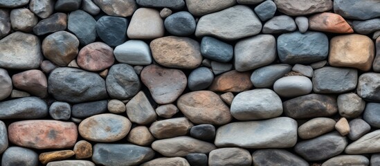 Poster - a stone wall made of rocks of various sizes and colors creates a stunning pattern, showcasing the be