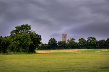 walking in north norflok in pring, view of the church of all saints, walcott