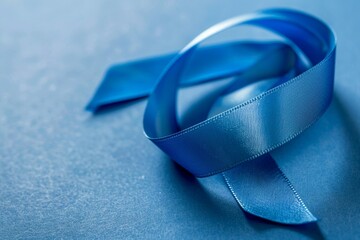 Poster - A blue ribbon is laying on a blue surface