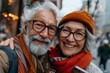 Wonderful sincere and cheerful pair of white-haired mature smiling people selfie on their mobile phones. Enjoy life. Pay attention to the health of the elderly

