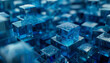 Blue cubes in various shapes and arrangements occupy a large space, captured with tilt-shift photography, revealing complex layers, textures, and hidden details.