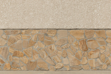 Wall Mural - Facade building exterior house with light plaster wall and stone brown pattern texture background abstract