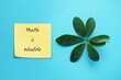 Green Leaves on blue background with text written note HEALTH is WEALTH - Concept of work life balance - health is valuable that investing in wellness now will help you in the future