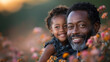 Happy African father daughter moment in flower field during sunset