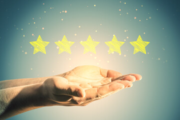 Poster - Close up of man hand holding 5 star rating on blurry background. Customer service and excellent feedback concept.
