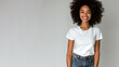 Afro woman wear white t-shirt smile isolated on grey background