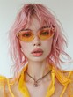 A photo of a model with pink hair wearing gold futuristic sunglasses in the style of minimalism