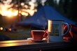 Camping Mug and Book: Zoom in on a camping mug placed next to an open book.