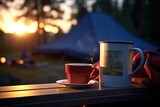 Fototapeta  - Camping Mug and Book: Zoom in on a camping mug placed next to an open book.