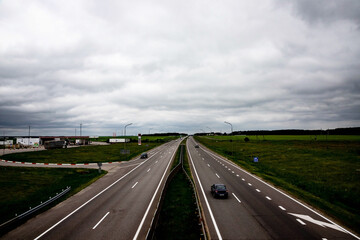 Freeway, expressway with moving cars. Logistics concept.