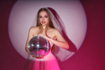 Poster - Beautiful young bride with disco ball on color background