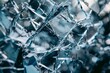 A detailed close up of a shattered glass window, showing sharp edges and fractured pieces